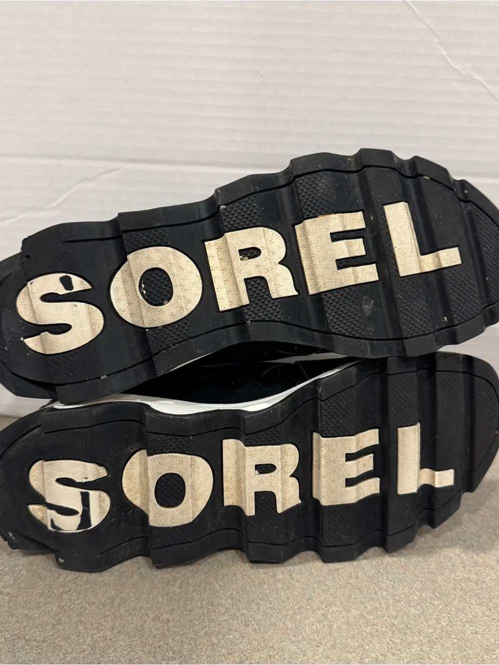 Sorel Women’s Kinetic Speed Black and White Wave-Soled Slip-On Sneakers